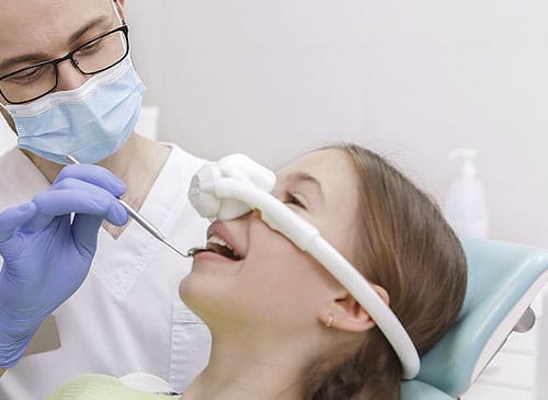 A doctor is taking care of his patient for Sedation dentistry